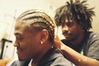 Aaron braiding Zane's hair