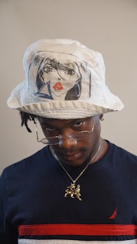a man wearing a white bucket hat