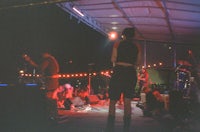 a group of people on stage at a concert