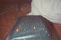 a bed with a blanket on top of it