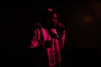 a man is singing into a microphone