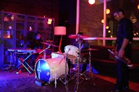 a group of people playing music in a room