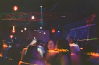 a blurry picture of people in a club