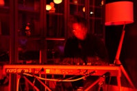 a man playing a keyboard in a dark room